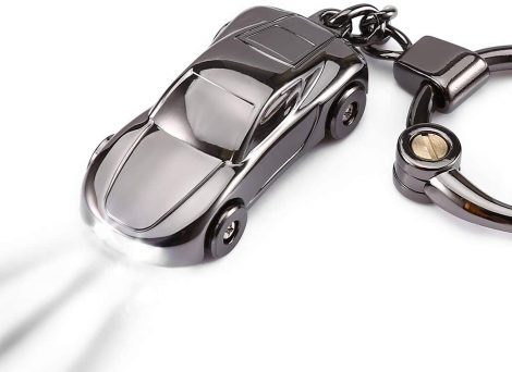 “Delfino Keychain Flashlight: Stylish black zinc alloy keychain with 2-mode LED light, perfect for stylish car decor.”