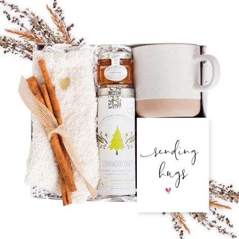 Women’s Care Package: Tea Gift Basket for Wellness, featuring Organic Chai Tea, Honey, Cozy Socks, Mug, Card.