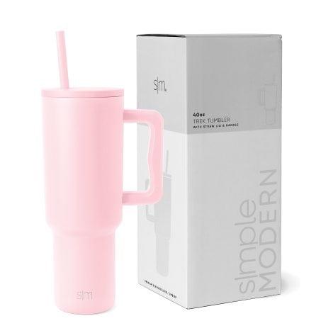 Blush-colored, stainless steel travel mug with handle, straw lid, and insulation – perfect for gifts.